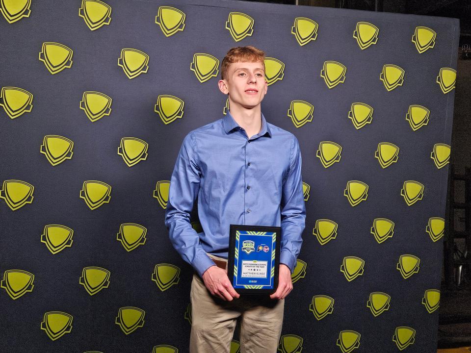 Harrison senior Matthew Klinge who won Indiana High School Sports Male Swimmer of the Year holds up his award on Tuesday, April 23, 2024 at Clowes Memorial Hall on the campus of Butler University in Indianapolis, Ind.