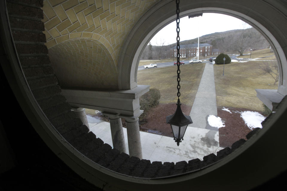 A view through a window at Kenarden Hall looks out onto an historic 217-acre campus in Northfield, Mass. in this photo taken Thursday, March 8, 2012. The campus, along with its 43 buildings, is being offered for free to an orthodox Christian group who can come up a solid plan to use it. (AP Photo/Elise Amendola)