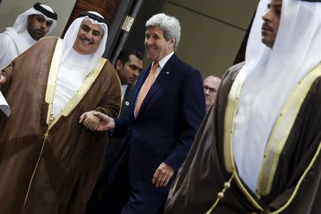 Bahrain's Foreign Minister Sheikh Khalid bin Ahmed al-Khalifa (L) and U.S. Secretary of State John Kerry (3rd R) arrive to speak to reporters ahead of the Gulf Cooperation Council (GCC) Ministerial meeting in Manama, Bahrain April 7, 2016. REUTERS/Jonathan Ernst