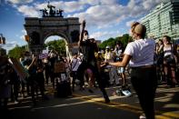 Demonstrators interact during a protest against racial inequality in the aftermath of the death in Minneapolis police custody of George Floyd, at Grand Army Plaza in the Brooklyn borough of New York City