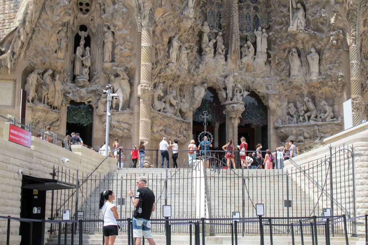 BARCELONA, July 5, 2020  -- People visit the Sagrada Familia basilica on the day of its reopening in Barcelona, Spain, July 4, 2020. One of Spain's most famous landmarks, Sagrada Familia basilica in Barcelona, opened its doors to visitors on Saturday for the first time since Spain was placed under lockdown on March 14 due to the coronavirus pandemic.     During the first phase of its reopening, access to the building is given only to healthcare workers, police officers, security and social workers and those who work for charity organizations, as well as those who ensured the supply of vital goods and services during the worst time of the coronavirus crisis. (Photo by Ismael Peracaula/Xinhua via Getty) (Xinhua/ via Getty Images)