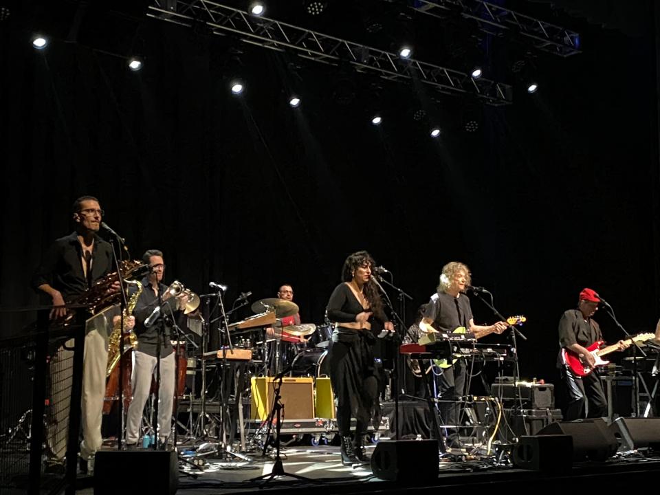 An 11-piece band entertained at the Jerry Harrison-Adrian Belew concert Friday at the Roxian Theatre.