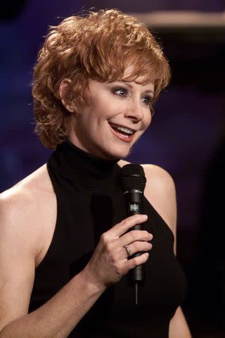 <p>Paul Drinkwater/NBCU Photo Bank/NBCUniversal via Getty</p> Reba McEntire performs on the Tonight Show with Jay Leno on May 4, 2000.