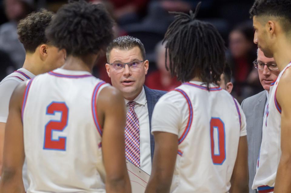 Bradley head coach Brian Wardle talks with his players as they try to rally against Cleveland State in the final minutes of their nonconference basketball game Friday, Dec. 15, 2023 at Carver Arena. The Braves fell to the Vikings 76-69.