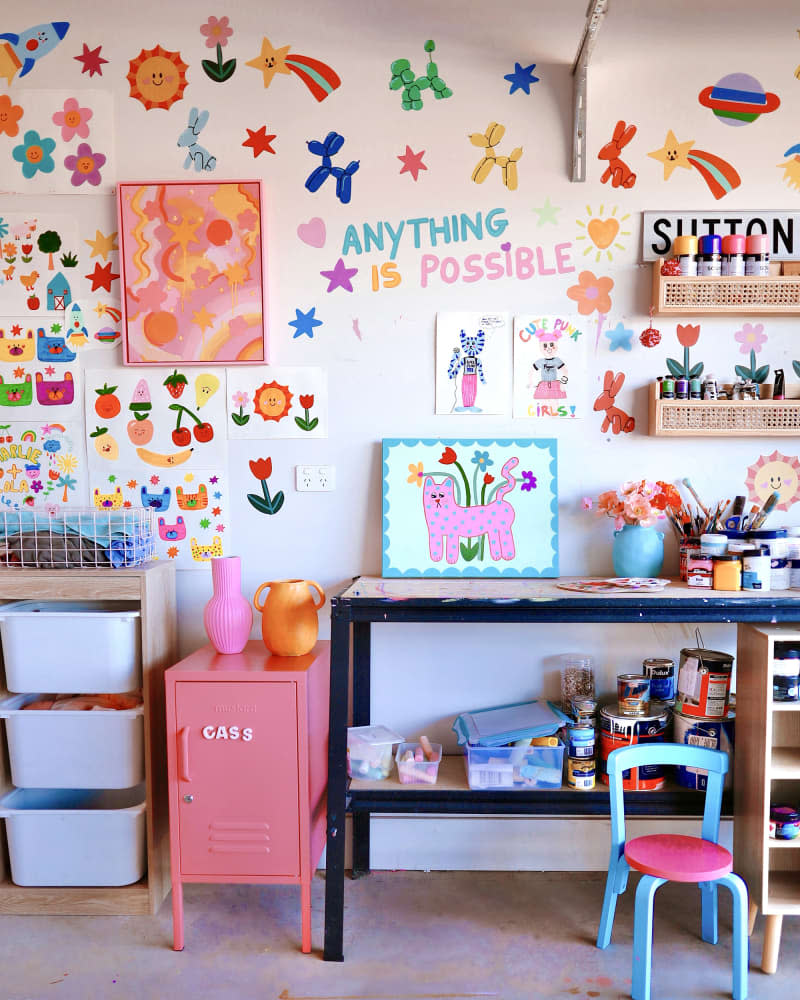 creative area in kids' space with art table, art supplies, and lots of art around