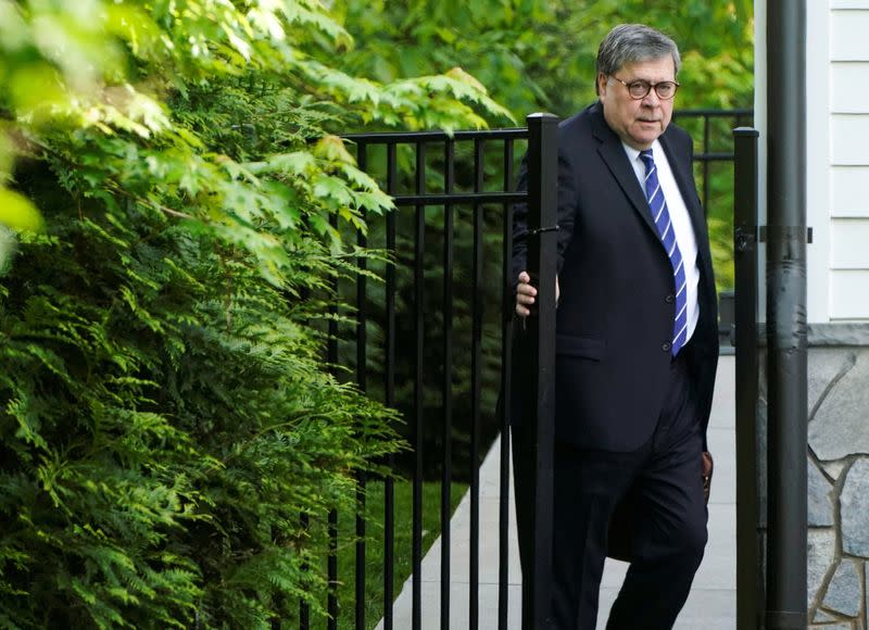 FILE PHOTO: U.S. Attorney General Barr leaves his house after cancelling plans to testify before the House of Representatives in McLean, Virginia