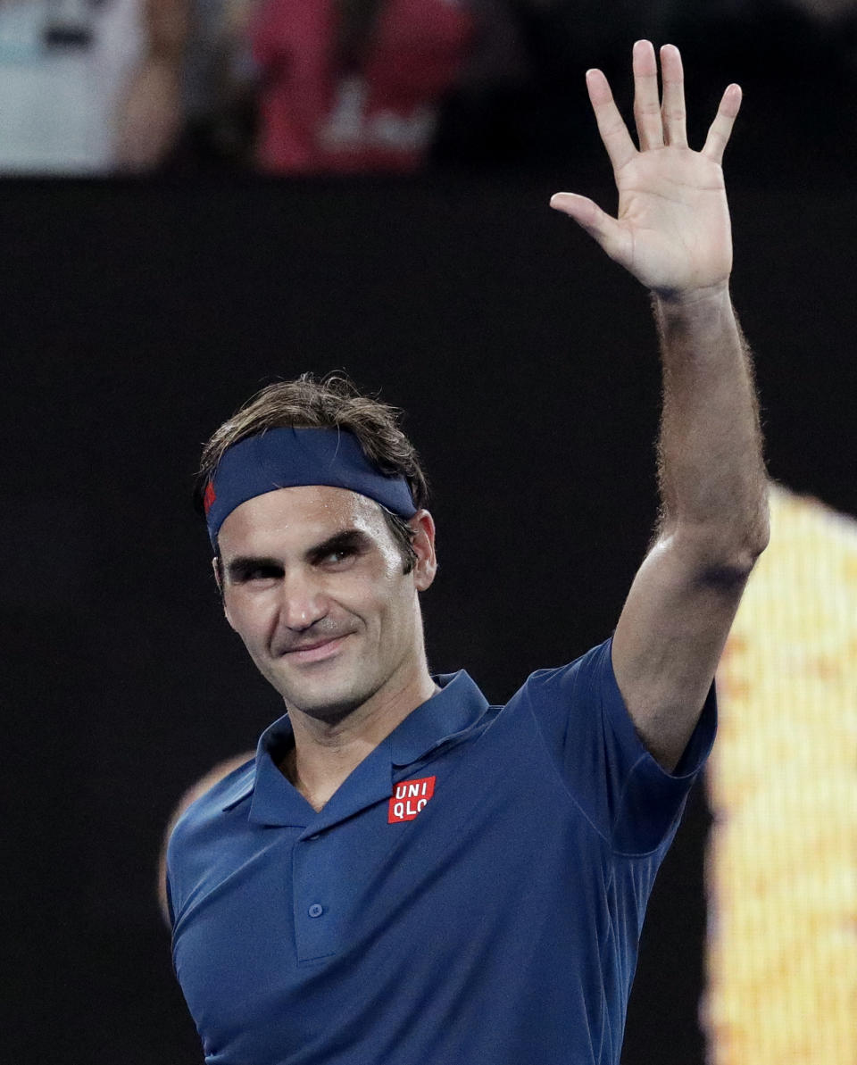 Switzerland's Roger Federer celebrates after defeating Uzbekistan's Denis Istomin during their first round match at the Australian Open tennis championships in Melbourne, Australia, Monday, Jan. 14, 2019.(AP Photo/Aaron Favila)