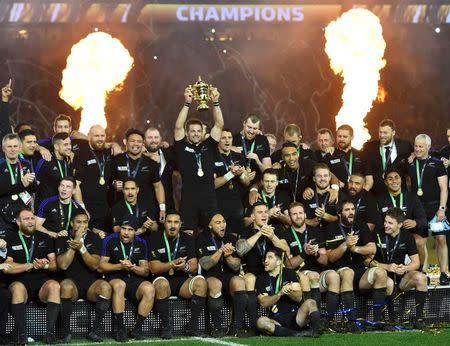 Captain Richie McCaw of New Zealand holds up the Webb Ellis Cup after winning the Rugby World Cup Final against Australia at Twickenham in London, October 31, 2015. New Zealand won by 34-17. REUTERS/Toby Melville