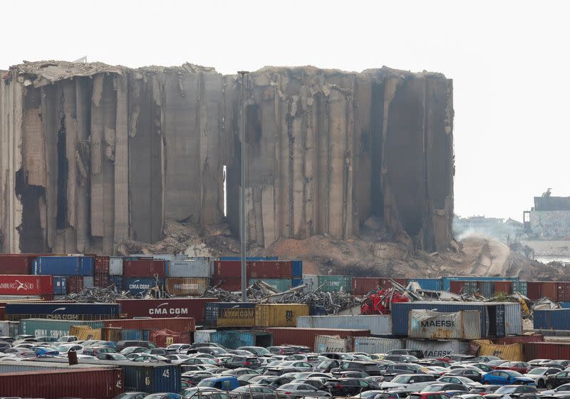 Dust rises as part of Beirut grain silos, damaged in the August 2020 port blast, collapses, in Beirut
