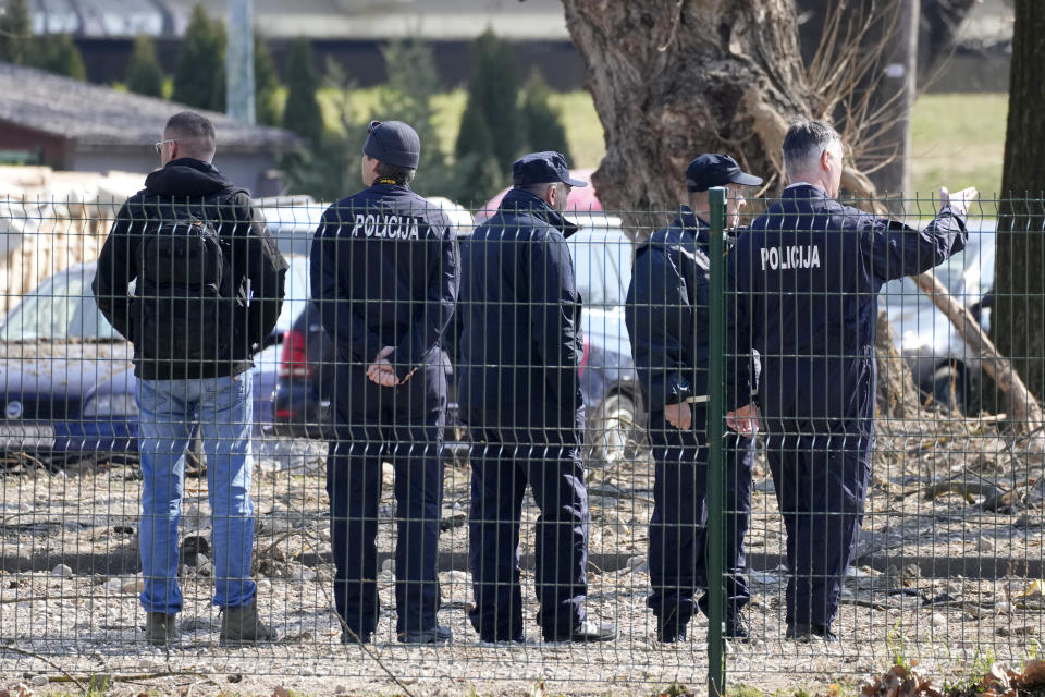 Police inspect site of a drone crash in Zagreb, Croatia, Friday, March 11, 2022. A drone that apparently flew all the way from the Ukrainian war zone crashed overnight on the outskirts of the Croatian capital, Zagreb, triggering a loud blast but causing no injuries, Croatian authorities said Friday. (AP Photo/Darko Bandic)