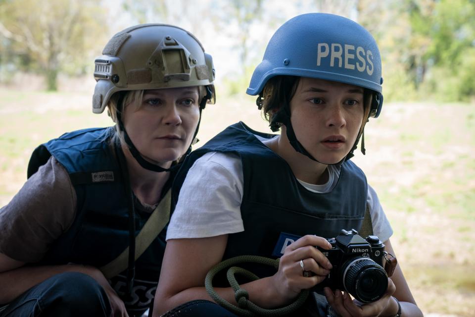 Acclaimed war photographer Lee (Kristen Dunst, left) becomes a reluctant mentor for young Jessie (Cailee Spaeny) in the action thriller "Civil War."