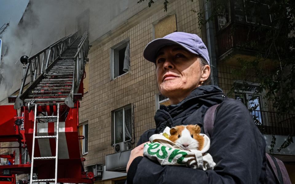 Man with guinea pig - SergeyBobok/AFP