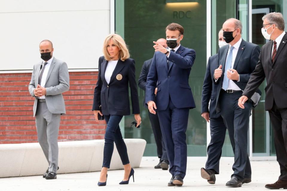 French President Emmanuel Macron and his wife Brigitte Macron vote at the polling station in Le Touquet, France, for the first round of the French regional elections on June 20, 2021. - Credit: AP