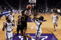 Wichita State guard Xavier Bell (1) puts up a shot during the first half of an NCAA college basketball game against Kansas State Saturday, Dec. 3, 2022, in Manhattan, Kan. (AP Photo/Charlie Riedel)
