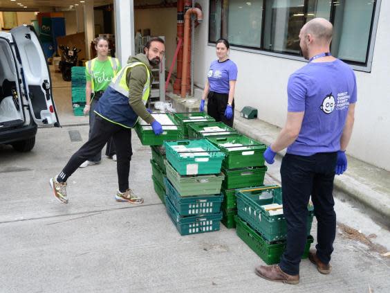 Helping hand: Evgeny Lebedev delivers 600 meals to Great Ormond Street staff with other Felix volunteers (Hannah Harley Young)