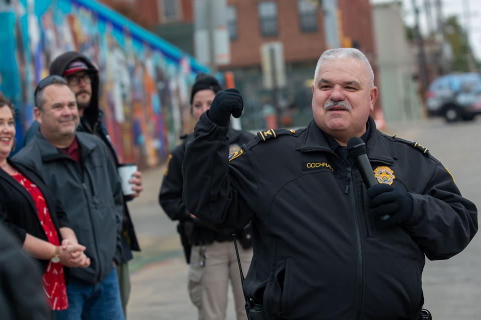 Then-Topeka Police Chief Bill Cochran gives thanks to the artist who created The Common Ground mural on Oct. 24, 2019.