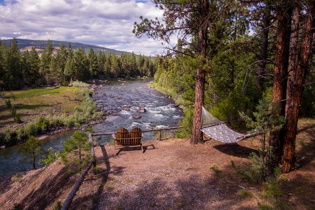 <p>Stuart Thurkilll/Courtesy of The Resort at Paws Up</p> Guests staying at the Blackfoot River Lodge or the seasonal glamping camps get prime views of the Blackfoot River.