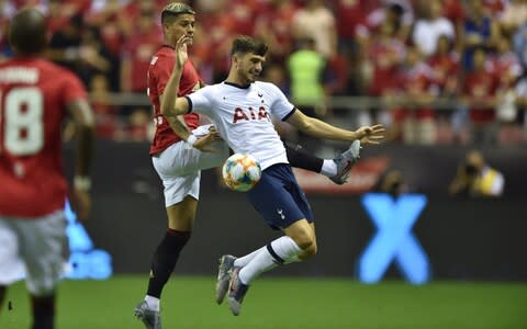 Manchester United's Marcos Rojo (L) fights for the ball with Tottenham's Troy Parrott (R) during the International Champions Cup football tournament between English Premier League sides Manchester United and Tottenham at Hongkou Football Stadium in Shanghai on July 25, 2019 - Credit: HECTOR RETAMAL/AFP/Getty Images Image title: AFP