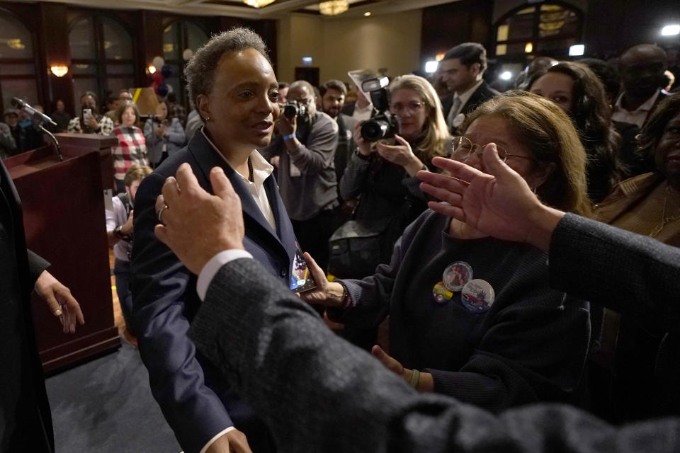 Chicago Mayor Lori Lightfoot, left, walks into the open arms of a supporter after conceding the mayoral election, late Tuesday, Feb. 28, 2023, in Chicago. (AP Photo/Charles Rex Arbogast)