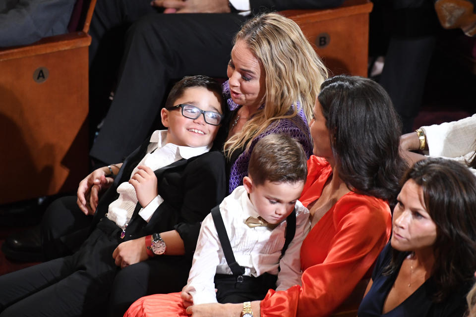 Becky Hammon, top left, sits with her family during the Basketball Hall of Fame enshrinement ceremony, Saturday, Aug. 12, 2023, in Springfield, Mass. (AP Photo/Jessica Hill)