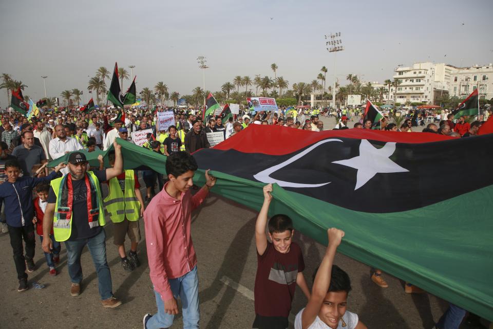 Libyans hold a demonstration at Martyrs' Square against military operations by forces loyal to Field Marshal Khalifa Hifter in Tripoli, Libya, Friday, May 3, 2019. (AP Photo/Hazem Ahmed)