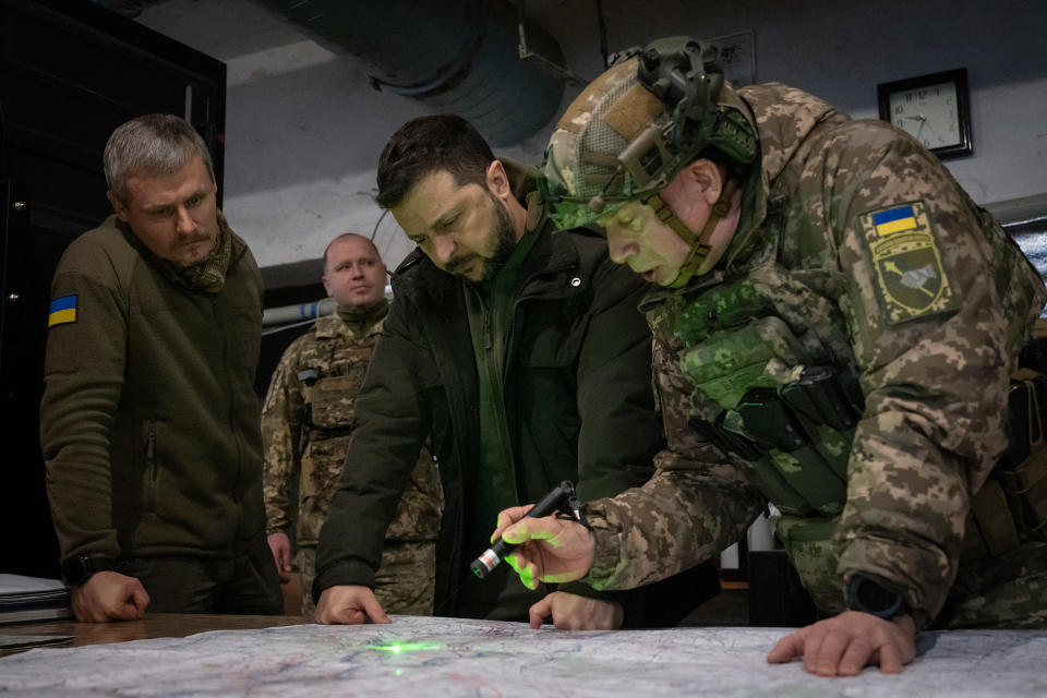 Ukrainian President Zelensky and Commander of Ukraine's Ground Forces Col.-Gen. Oleksandr Syrsky, look at a map during their visit to the front line city of Kupiansk, Ukraine on Nov. 30, 2023. <span class="copyright">Efrem Lukatsky—AP</span>