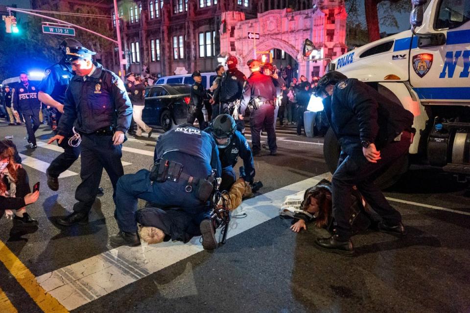 Police arrest protesters at The City College Of New York as the NYPD cracks down on protest camps (Getty Images)