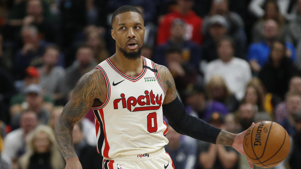 Despite Portland's "no" vote, the NBA's plan should quell any concern about Damian Lillard playing. (AP Photo/Rick Bowmer)