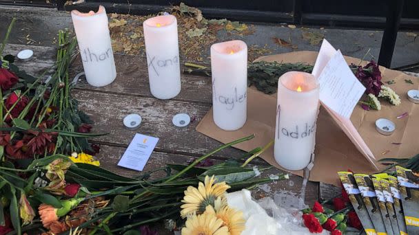 PHOTO: Candles and flowers are left at a make-shift memorial honoring four slain University of Idaho students outside the Mad Greek restaurant in downtown Moscow, Idaho, on Tuesday, Nov. 15, 2022. (Nicholas K. Geranios/AP)