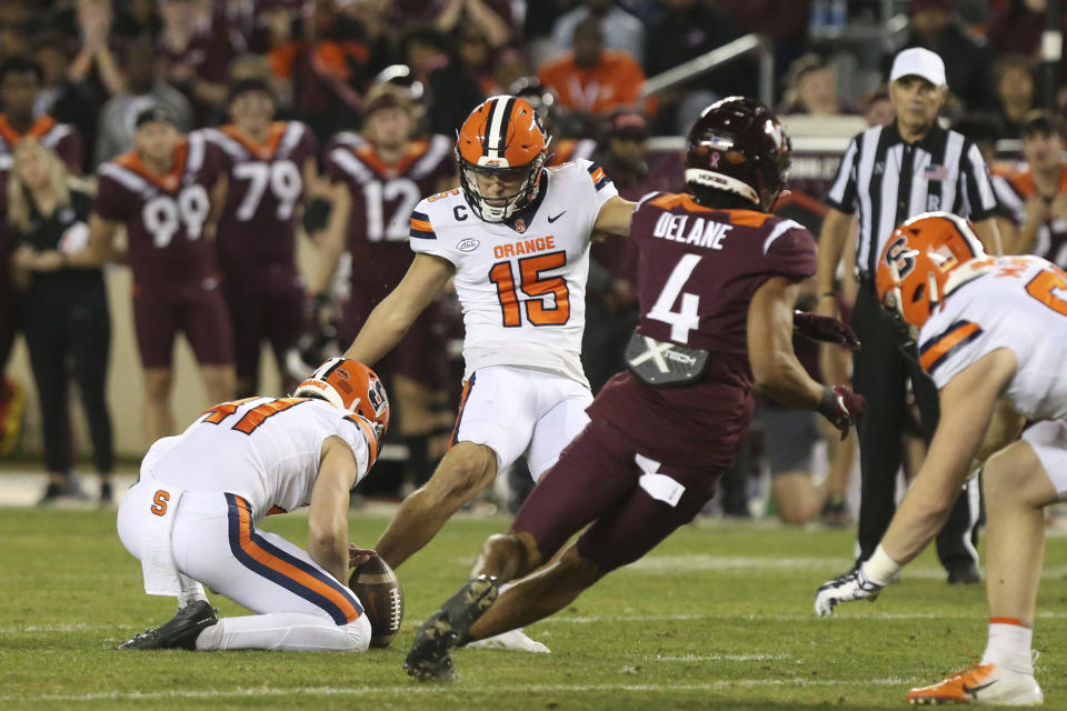 Syracuse's Brady Denaburg (15) hits a field goal against Virginia Tech during the first half of an NCAA college football game Thursday, Oct. 26, 2023, in Blacksburg, Va. (Matt Gentry/The Roanoke Times via AP)