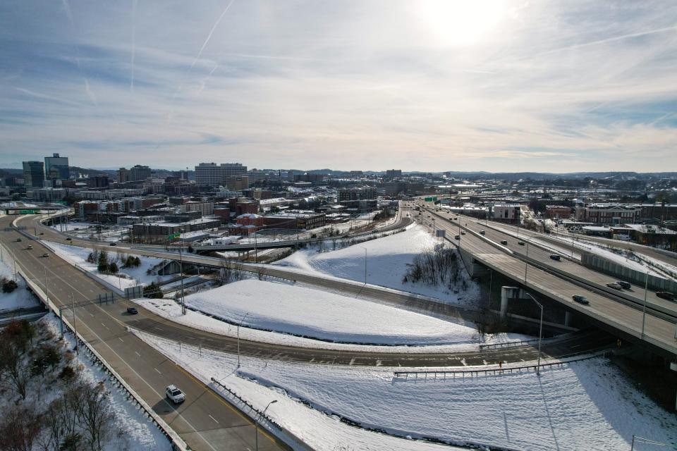 This aerial video of downtown Knoxville and I-40 shows snow still covering the ground Jan. 21, nearly a week since it began accumulating in East Tennessee. The Knox County Regional Forensic Center has reported nine deaths believed to have been caused by the recent winter weather, including seven possibly due to hypothermia.