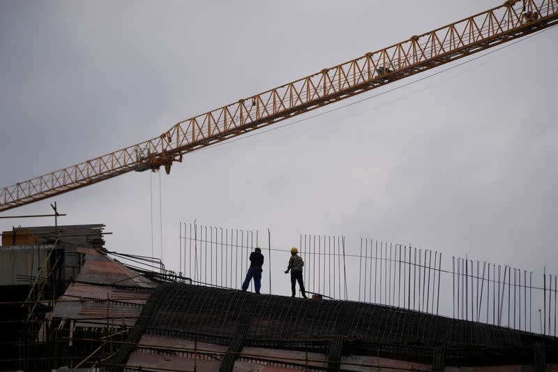 Workers work at a construction site, following the COVID-19 outbreak, in Shanghai