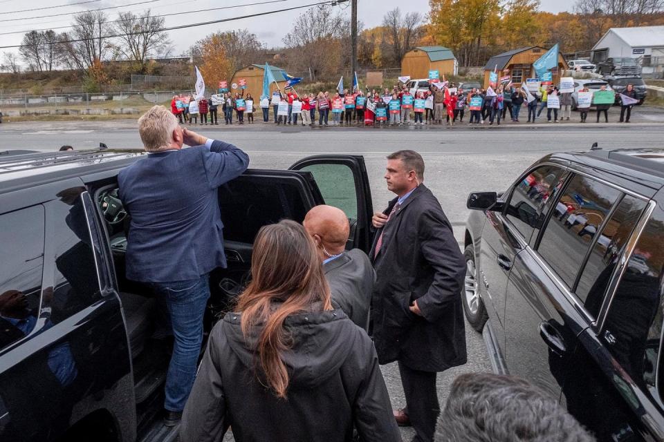 <span class="caption">Ontario Premier Doug Ford acknowledges people as they protest cuts to education in Kenora, Ont., as he leaves an event in October 2019.</span> <span class="attribution"><span class="source">THE CANADIAN PRESS</span></span>