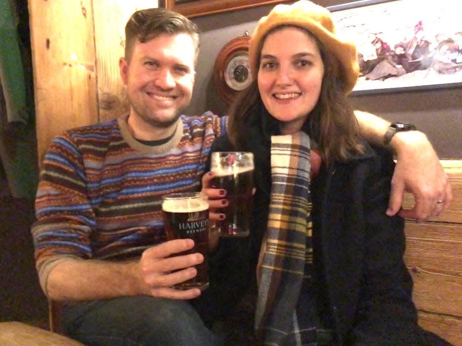 Lydia and Ryan with pints at the pub in the UK.