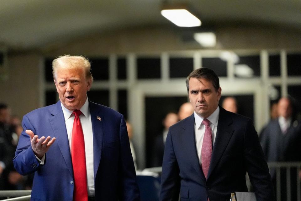 Donald Trump and his attorney Todd Blanche appear in a Manhattan criminal courthouse on 6 May (POOL/AFP via Getty Images)