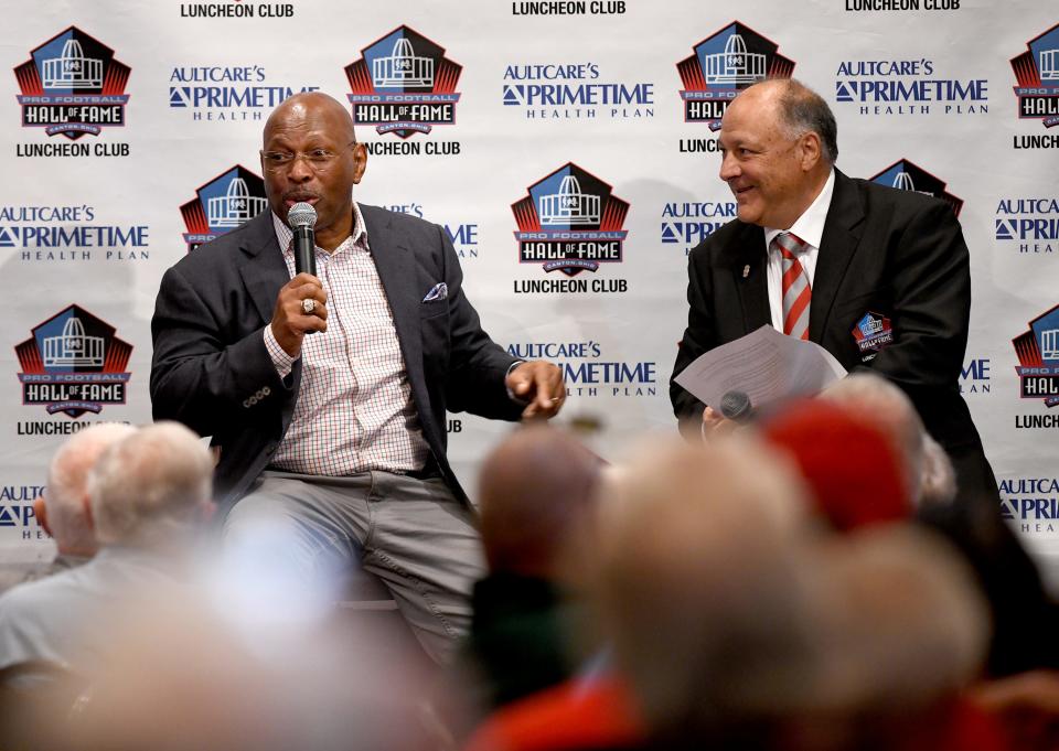 Former Ohio State and Cincinnati Bengals play Archie Griffin talks with Frank Cilona, President of the Pro Football Hall of Fame Luncheon Club during the Luncheon Club. Monday, May 13, 2024.