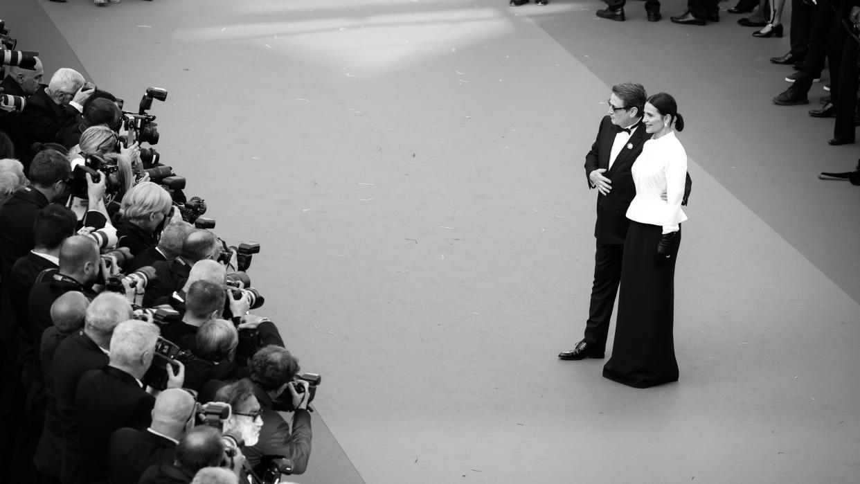  Benoît Magimel and Juliette Binoche attend the "La Passion De Dodin Bouffant" red carpet during the 76th annual Cannes film festival. 