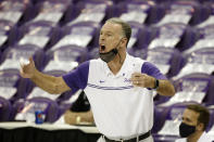 TCU head coach Jamie Dixon directs his team against Texas during the first half of an NCAA college basketball game in Fort Worth, Texas, Sunday, March 7, 2021. (AP Photo/Michael Ainsworth)