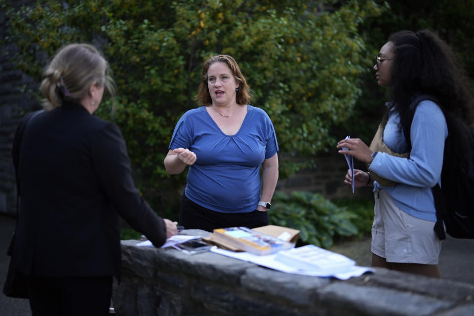 Heather Boyd, center, Democratic candidate for Pennsylvania House of Representatives, talks with supporters before voting at her polling place, Christ's Community Church, Tuesday, May 16, 2023, in Drexel Hill, Pa. (AP Photo/Matt Slocum)