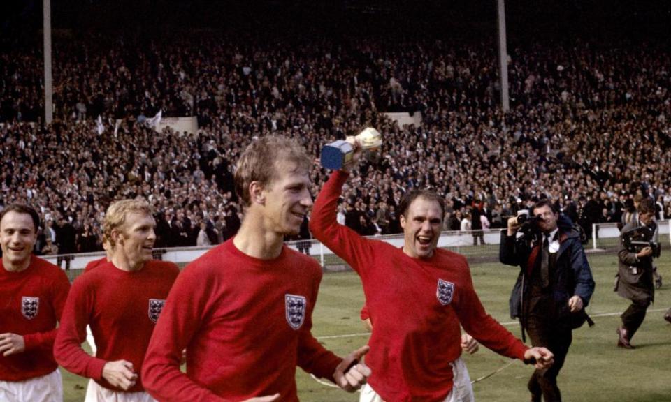 Left to right: England’s George Cohen, Bobby Moore, Jack Charlton and Ray Wilson (with trophy) celebrate after winning the 1966 World Cup.