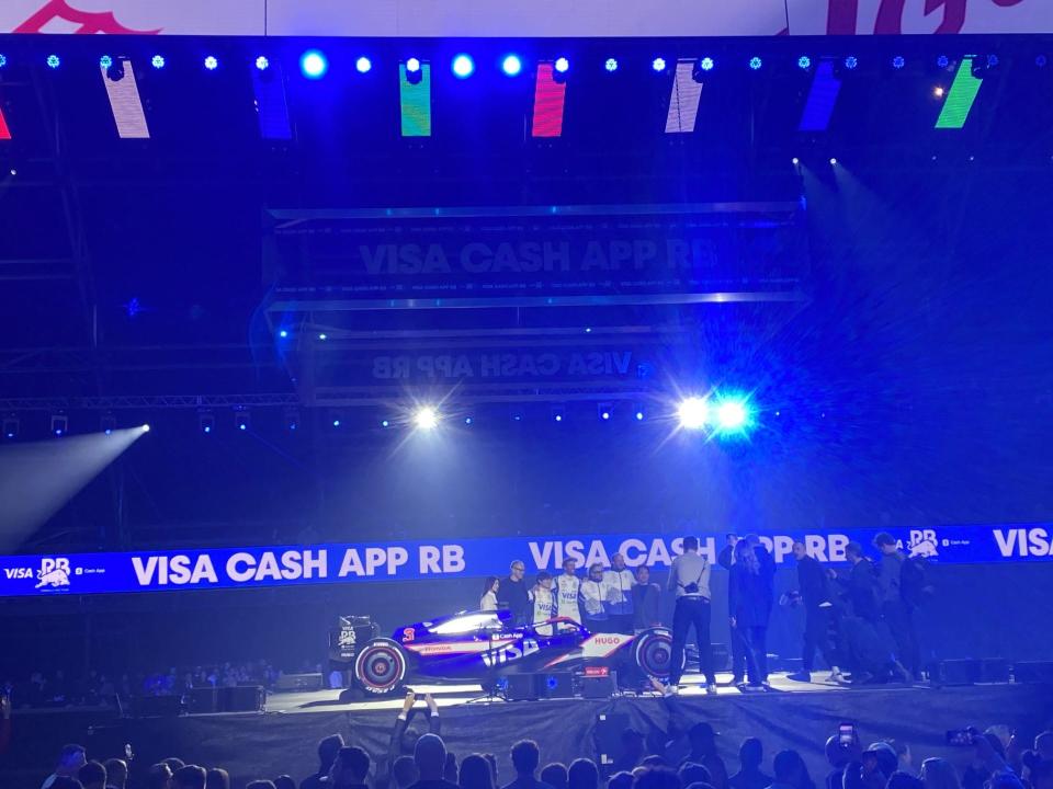 The Visa Cash App RB Formula 1 car is revealed during an event in Las Vegas over Super Bowl weekend. F1 Academy driver Amna Al Qubaisi, F1 drivers Yuki Tsunoda and Daniel Ricciardo and team principal Laurent Mekies pose in front of the new livery.
