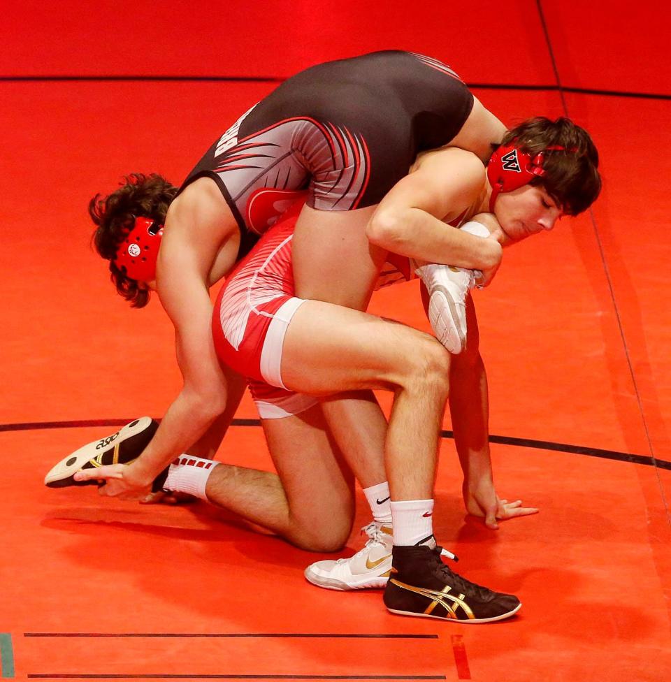 Kade Mellon of Wadsworth and Chase Pluhar of Brecksville wrestle in the 132 weight class at Brecksville-Broadview Heights High School  in Broadview Heights.