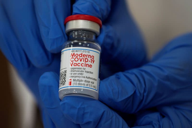 FILE PHOTO: Healthcare workers receive the Moderna COVID-19 vaccine