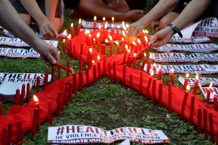 People light candles to mark World AIDS day in Quezon city, Metro Manila, Philippines December 1, 2016. REUTERS/Czar Dancel