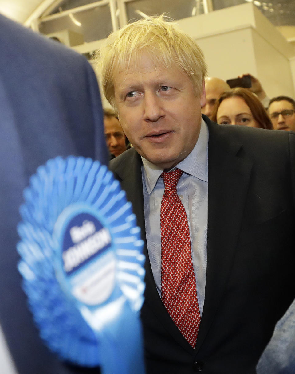 Britain's Prime Minister and Conservative Party leader Boris Johnson arrives for the Uxbridge and South Ruislip constituency count declaration at Brunel University in Uxbridge, London, Friday, Dec. 13, 2019. (AP Photo/Kirsty Wigglesworth)