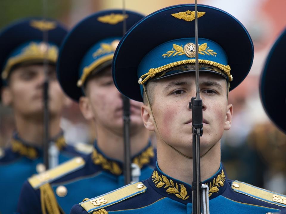 Russians stand during the Victory Day military parade to celebrate 74 years since the victory in WWII in Red Square in Moscow, Russia, Thursday, May 9, 2019. Putin told the annual military Victory Day parade in Red Square that the country will continue to strengthen its armed forces. (AP Photo/Alexander Zemlianichenko)