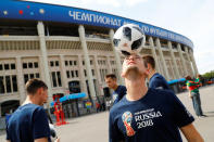 Soccer Football - World Cup - Group A - Russia vs Saudi Arabia - Luzhniki Stadium, Moscow, Russia - June 14, 2018 A football freestyle artists performs outside the stadium before the match REUTERS/Kai Pfaffenbach