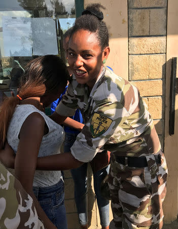 A female officer from the Tigray police performs a body check at the entrance to a museum that commemorates the defeat by the Tigrayan PeopleÕs Liberation Front of the communist military regime in Mekelle, Tigray region, Ethiopia December 10, 2018. REUTERS/Maggie Fick