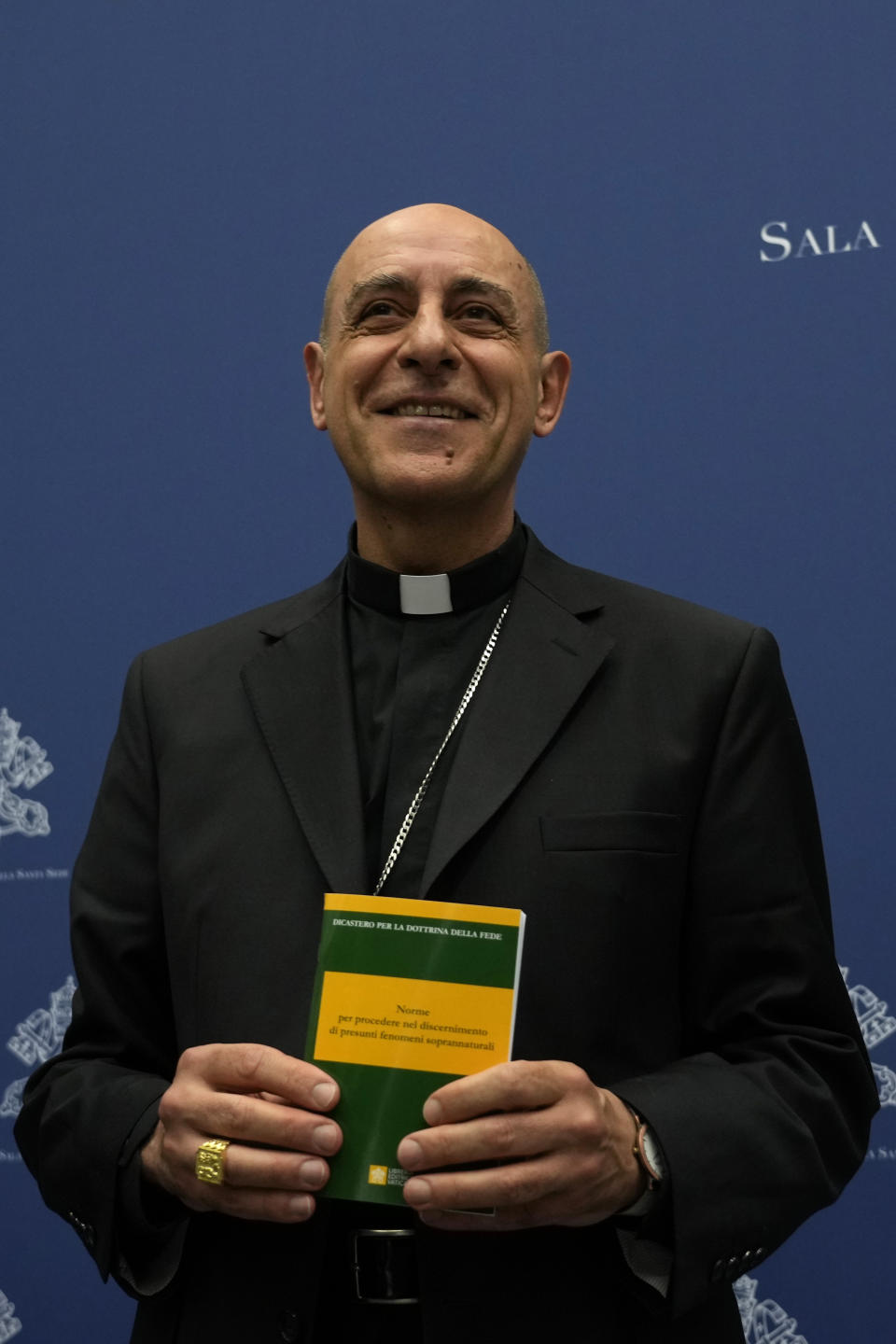 Argentine Cardinal Victor Manuel Fernandez, head of the Vatican doctrine office, poses for photographers at the end of a press conference at the Vatican, Friday, May 17, 2024. The Vatican on Friday radically reformed its process for evaluating alleged visions of the Virgin Mary, weeping statues and other seemingly supernatural phenomena that have long punctuated church history, putting the brakes on making definitive declarations unless the event is obviously fabricated. (AP Photo/Alessandra Tarantino)