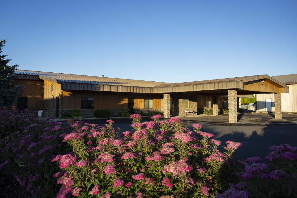 Flowers bloom outside of the Lighthouse Pentecostal Church in Island City, Ore. on Friday, July 10, 2020. In mid-June, the small-town church in northeastern Oregon became the epicenter of the state's largest coronavirus outbreak when over 200 people linked to the Lighthouse Pentecostal Church tested positive. (AP Photo/Ben Lonergan)